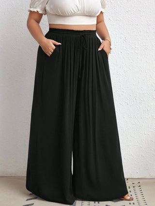 Pantalones de tiro alto con pierna ancha, con cintura en la cintura, bolsillos laterales, en tejido de canalé