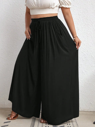 Pantalones de tiro alto con pierna ancha, con cintura en la cintura, bolsillos laterales, en tejido de canalé