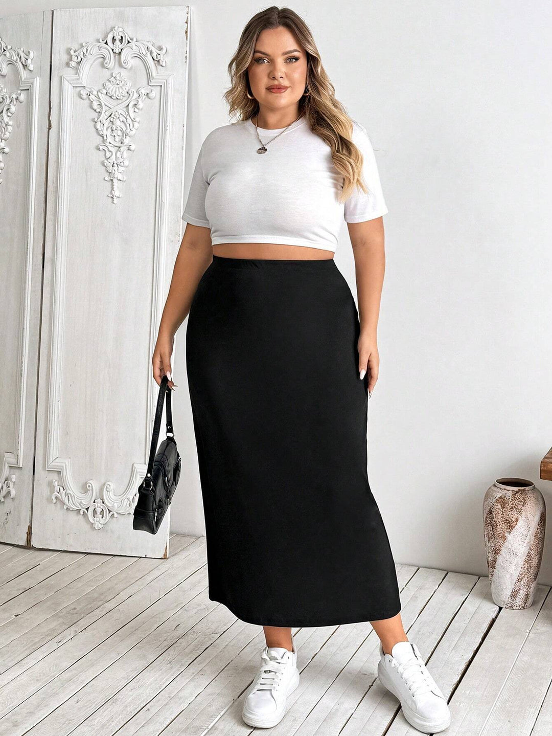 Falda lápiz midi elástica negra de talla grande para mujer