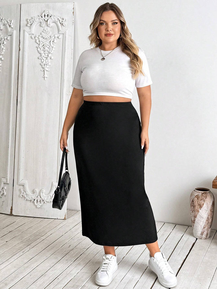 Falda lápiz midi elástica negra de talla grande para mujer