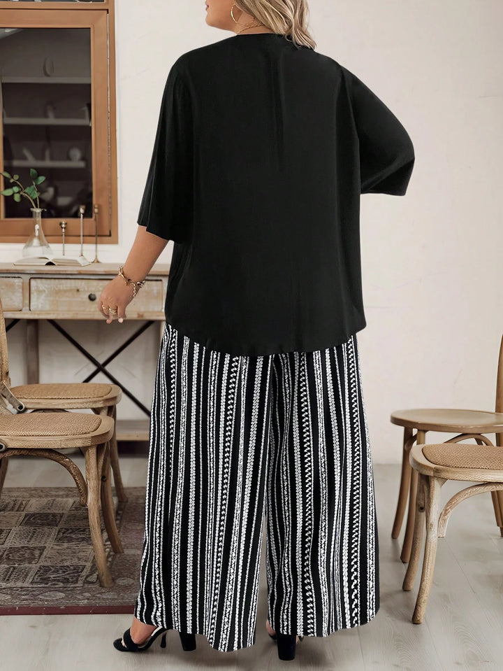 Conjunto de mujer tallas grandes compuesto por 2 piezas, top negro con escote en V de manga corta y pantalones estampados