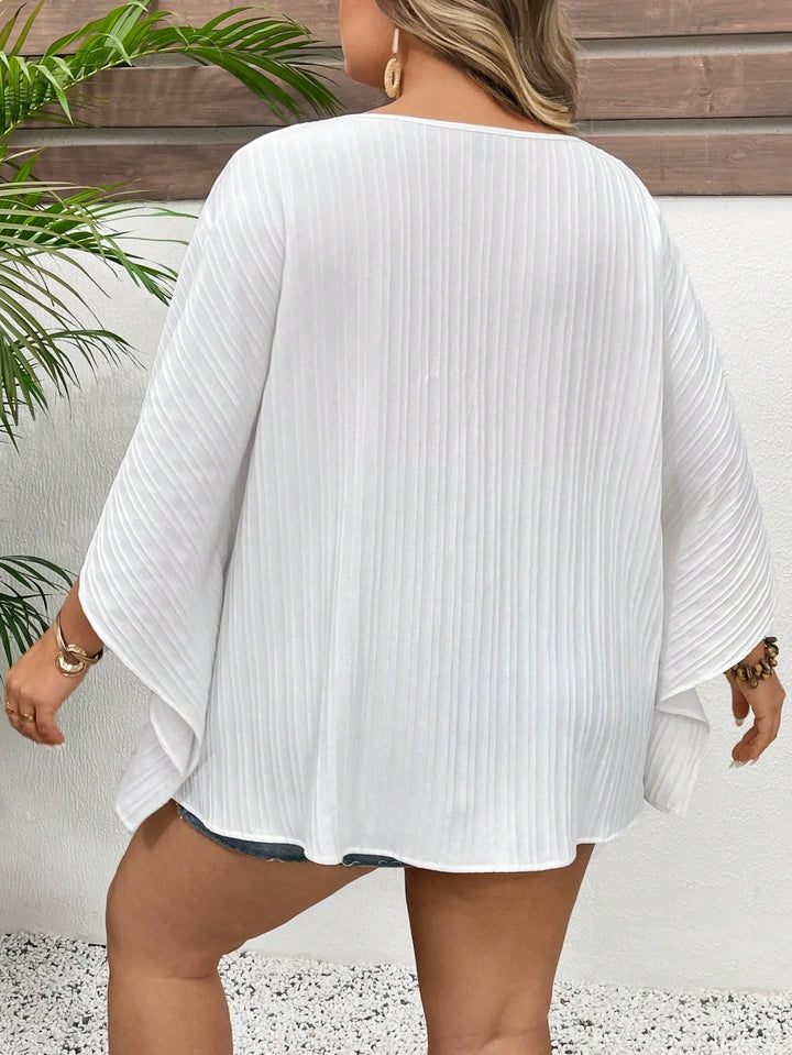 Camisa de mujer tallas grandes con escote en V, mangas de murciélago, textura de vacaciones, estilo boho para vacaciones