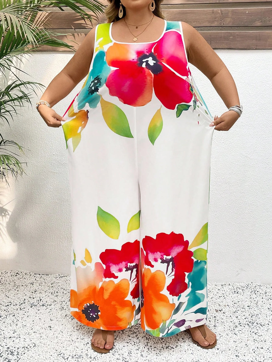 Mono largo elegante de estilo amplio con escote de ciambella, sin mangas, con estampado floral colorido
