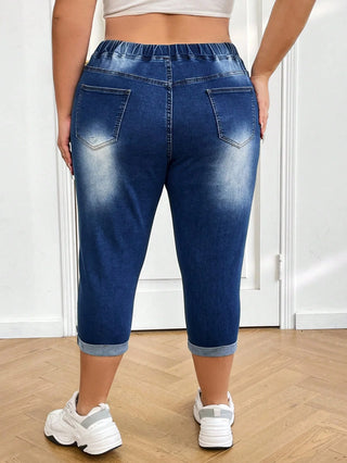 Jeans casual de mezclilla de media longitud con cintura alta, rasgados y cierre frontal, adecuados para las vacaciones de verano en tallas grandes