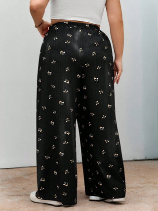 Pantalones largos de cintura elástica en tejido negro con estampado floral, casuales, cómodos y ligeros