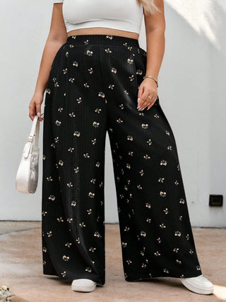 Pantalones largos de cintura elástica en tejido negro con estampado floral, casuales, cómodos y ligeros