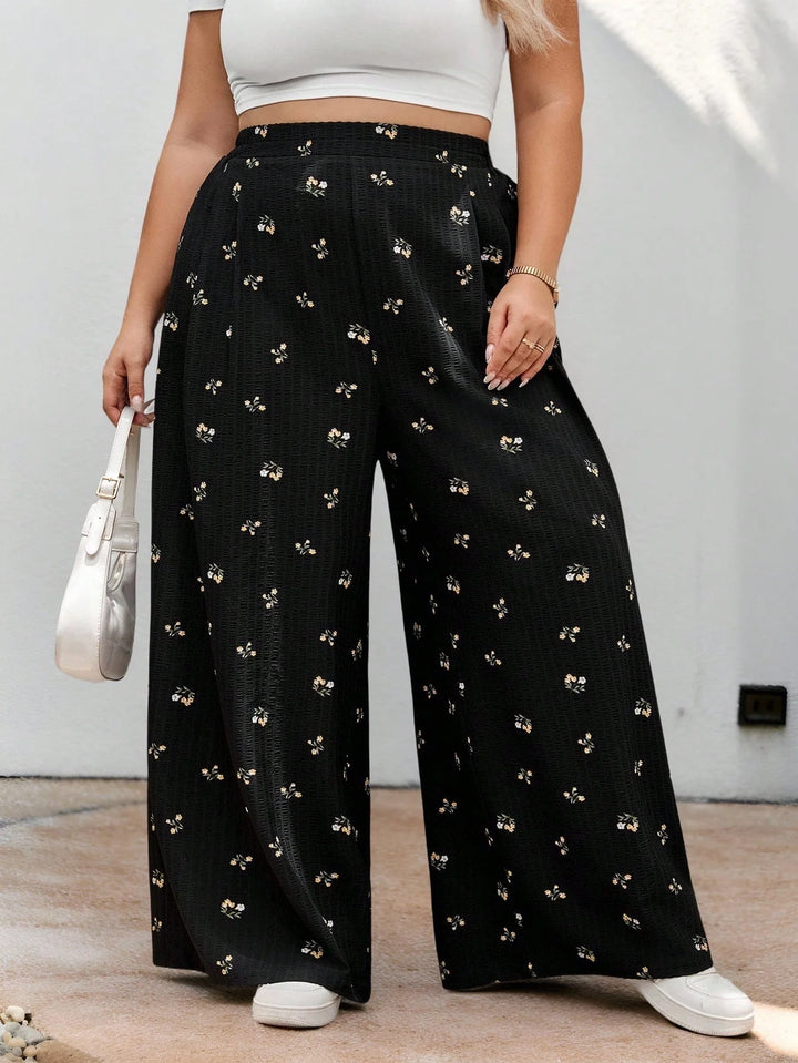 Pantalones largos de cintura elástica en tejido negro con estampado floral, casuales, cómodos y ligeros
