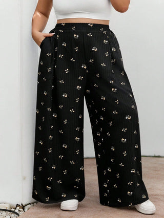 Pantalones largos de cintura elástica en tejido negro con estampado floral, casuales, cómodos y ligeros