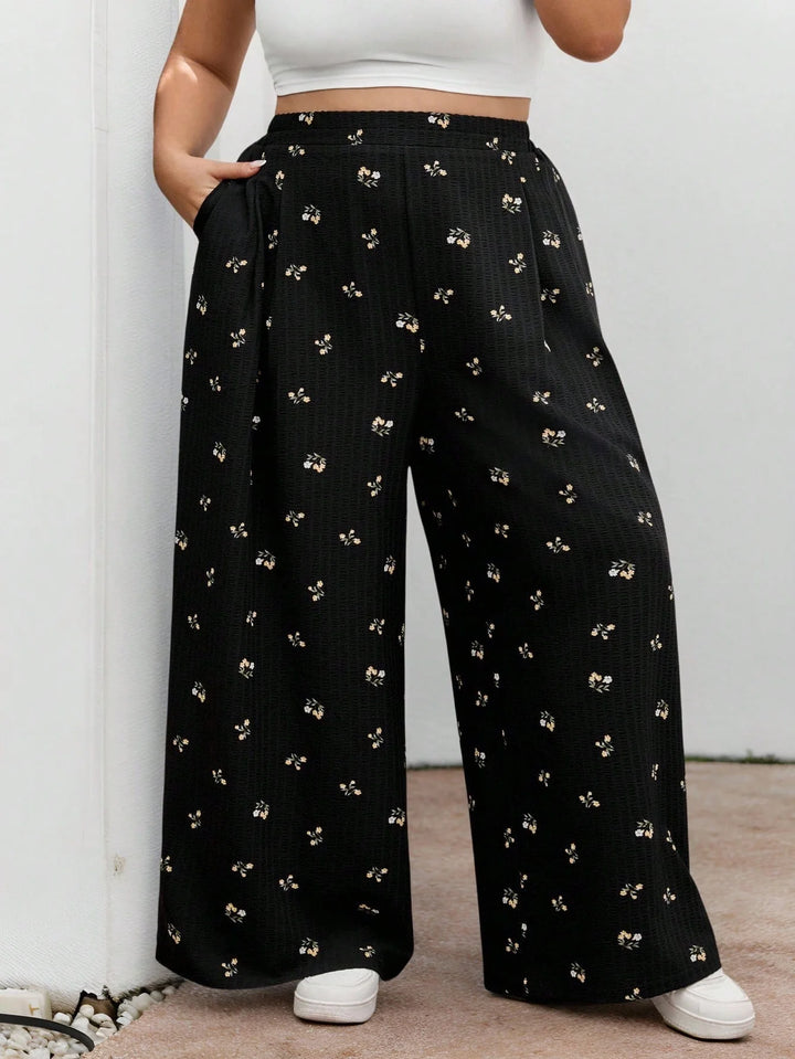Pantalones largos de cintura elástica en tejido negro con estampado floral, casuales, cómodos y ligeros