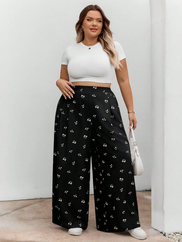 Pantalones largos de cintura elástica en tejido negro con estampado floral, casuales, cómodos y ligeros